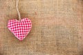 Red fabric heart, rustic canvas background Royalty Free Stock Photo