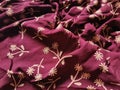 The background and pattern of the fabric is red with a simple flower image Royalty Free Stock Photo