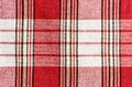 Red fabric with vertical and horizontal stripes of different widths