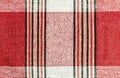 On the red fabric, vertical and horizontal strips of different w