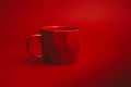 A red facture cup on a red background