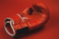 red faded boxing gloves on red background