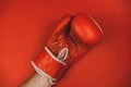 red faded boxing gloves on red background