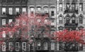 Red fall trees contrast against old brick buildings in black and white - New York City