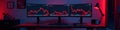 Red, falling stock chart on multiple monitors in dark room, panic, downturn Royalty Free Stock Photo