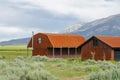 Red farm shed in a big grassland farm field Royalty Free Stock Photo