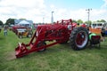 Red Farmall antique farming tractor.