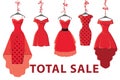 Red fashion women's dresses hang on ribbon.Big sale
