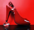 Red fashionable shoe and a diamond Royalty Free Stock Photo