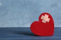 Red felt heart with adhesive plasters on table Royalty Free Stock Photo