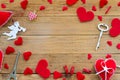 Red felt hearts and cupid angel border arrangement with copy space. Flat lay Happy Valentines day concept on wooden Royalty Free Stock Photo