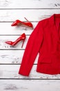 Red female suit jacket and high heel shoes.