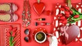 Red feminine accessories travel shopping planning packing concept flatlay.