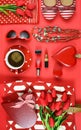 Red feminine accessories travel shopping planning packing concept flatlay.