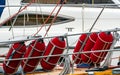 Red fender buoys secured on the deck of a ship