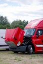 Red fensy commercial semi truck rig with open hood Royalty Free Stock Photo