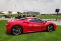 Red ferrari in parking slot