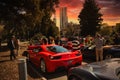 Red Ferrari super car in Melbourne with people outside the Royal exhibition building