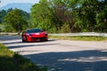 Red Ferrari 812 Superfast captured in a car racing rally