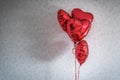 Red festive heart shaped balloon and wall