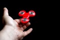 Red fidget spinner in action