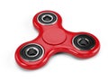 Red fidget spinner stress relieving toy isolated on white background