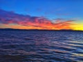 Red fiery lake sunset at dusk.