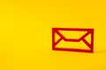 Red figure of envelope mailing service post connecting people new app isolated over bright vivid shine vibrant yellow