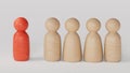 red figurine of a man stands aside from the crowd of people. Asociality, sociopathy. Rejected from society, lonely. Royalty Free Stock Photo