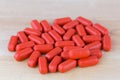 Red film coated tablets of Multi Vitamins and Minerals, anti stress formula Royalty Free Stock Photo