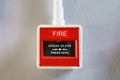 Red fire alarm box on white background Royalty Free Stock Photo