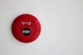 Red fire alarm on cement wall. Royalty Free Stock Photo