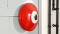 Red fire alarm device with a white and black central element on a wall image photo Royalty Free Stock Photo