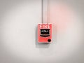 Red fire alarm equipment on concrete wall Royalty Free Stock Photo