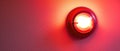 A Red Fire Alarm With A Glowing Light Against A White Wall Royalty Free Stock Photo