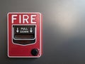 Red fire alarm on gray background Royalty Free Stock Photo