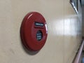 Red fire alarm round box on the wall Royalty Free Stock Photo