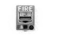 Red fire alarm switch at cement wall Royalty Free Stock Photo