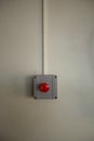 Red fire alarm switch at cement wall Royalty Free Stock Photo