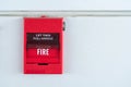 Red fire alarm switch on exterior cement wall of commercial building, safety concept. Royalty Free Stock Photo