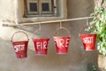 Red fire buckets filled with sand Royalty Free Stock Photo