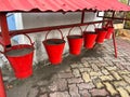 Red fire buckets filled with sand to protect in case of fire Fire Safety, Sand Filled Bucket Royalty Free Stock Photo