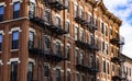 Red Fire escape stairs-downtown back alley architecture-steel and red brick background