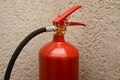 Red fire extinguisher close-up in office for safety, selective focus. Safety concept