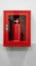 Red Fire Extinguisher Mounted in Safety Box on Wall Royalty Free Stock Photo
