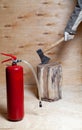 Red fire extinguisher and tree stump with ax Royalty Free Stock Photo