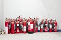 Red fire extinguishers in a group in construction building site