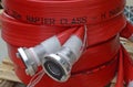 Red fire fighting hose , part of the mobile equipment on location at airports.
