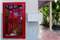 Red fire hose cabinet. Royalty Free Stock Photo