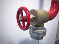 Red fire hose valve opposite white wall Royalty Free Stock Photo